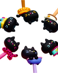 A collection of gel pens with cat-shaped, featuring various colorful pen bodies and cat erasers in black with different facial expressions and accessories.