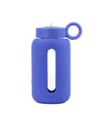 Glass water bottle with a protective silicone sleeve and screw on cap in navy.