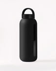 Glass water bottle with a protective silicone sleeve and screw on cap in black.