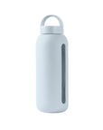 Glass water bottle with a protective silicone sleeve and screw on cap in blue.