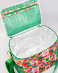 Colorful checkered bag with green strap on a white background
