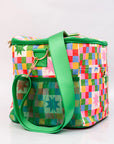 Colorful checkered bag with green strap on a white background