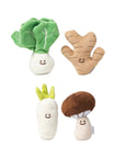Set of plush vegetable toys on a white background
