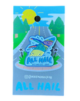 An enamel pin designed with a stylized whale and the text 'All Hail' against a blue background, presented on a card with a sun and road design.