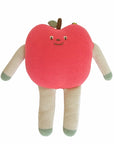 Knitted toy apple with a face on a white background