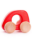 Red toy car with wooden wheels on a white background