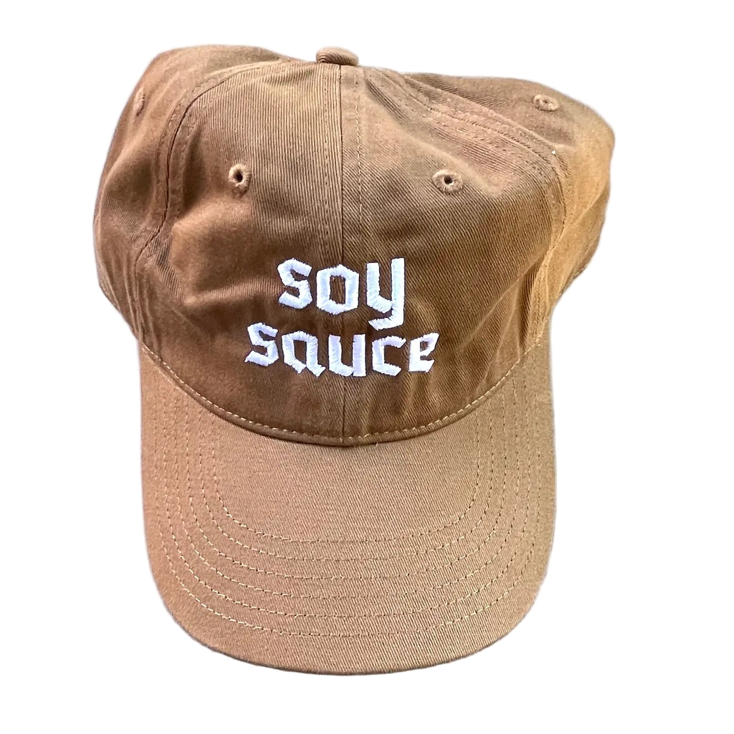 Brown ballcap with 'SOY SAUCE' text on a textured white surface