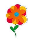 Colorful flower-shaped sticker with a smiley face on a light blue background