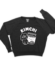 Black long sleeve tee screen printed with white ink, text KIMCHI and cabbage and jar of kimchi, both smiling.
