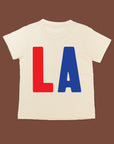 White tee screen printed with red L and blue A.