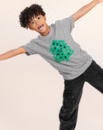 A child modeling a grey tee screen printed with a green Christmas tree with red ornaments, black happy face and MERRY MERRY adorning the tree.