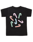 Black tee screen printed with green, red, blue, and purple smiling candy canes.