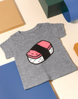 Grey tee screen printed with a smiling spam musubi.