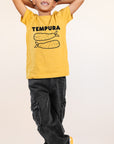 A child modeling a yellow tee with black graphic of word Tempura and two smiling tempura shrimp.
