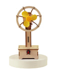 Wooden electric miniature windmill shaped fan on a white background