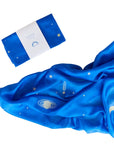 Blue fabric with celestial patterns and a folded packaging on a white background