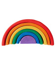 Colorful wooden rainbow toy on a light background