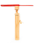 A wooden hand helicopter with red helicopter blades.