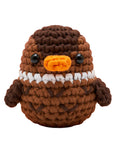 Crocheted duck toy with brown feathers, orange beak, and black eyes.