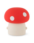 Back of Mushroom shaped night light with cute face and red cap and white spots.