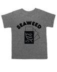 Grey tee screen printed with black ink with text reading SEAWEED above a smiling package of seaweed.