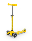 A Yellow and Light Yellow three wheeled push scooter with the front two wheels lit up with LED lights.