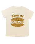 White tee screen printed with brown ink text BANH MI above a smiling banh mi sandwich.