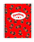 Notebook with Monchhichi character pattern on a red background