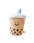 A plushie toy designed to look like a boba bubble tea drink with a smiling face, brown sugar cubes, and a blue straw on top.