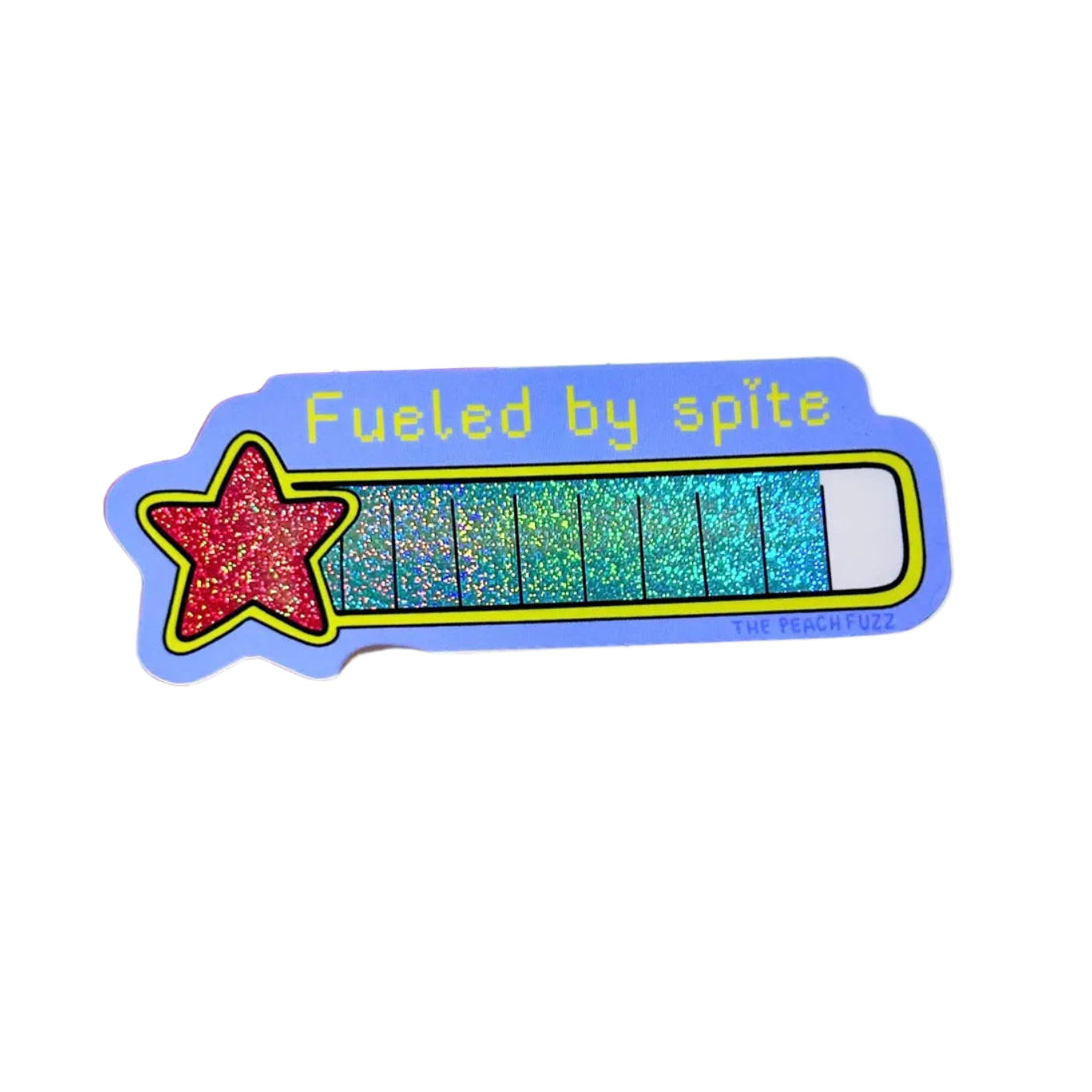 A sticker that  reads "Fueled by spite" with a red star and glitter scale.