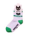 White sock with green accents and cat illustrations on a pink background