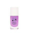 Glittery magenta nail polish bottle, featuring a silly, cross eyed face with a giant toothy grin on the glass portion of the bottle.