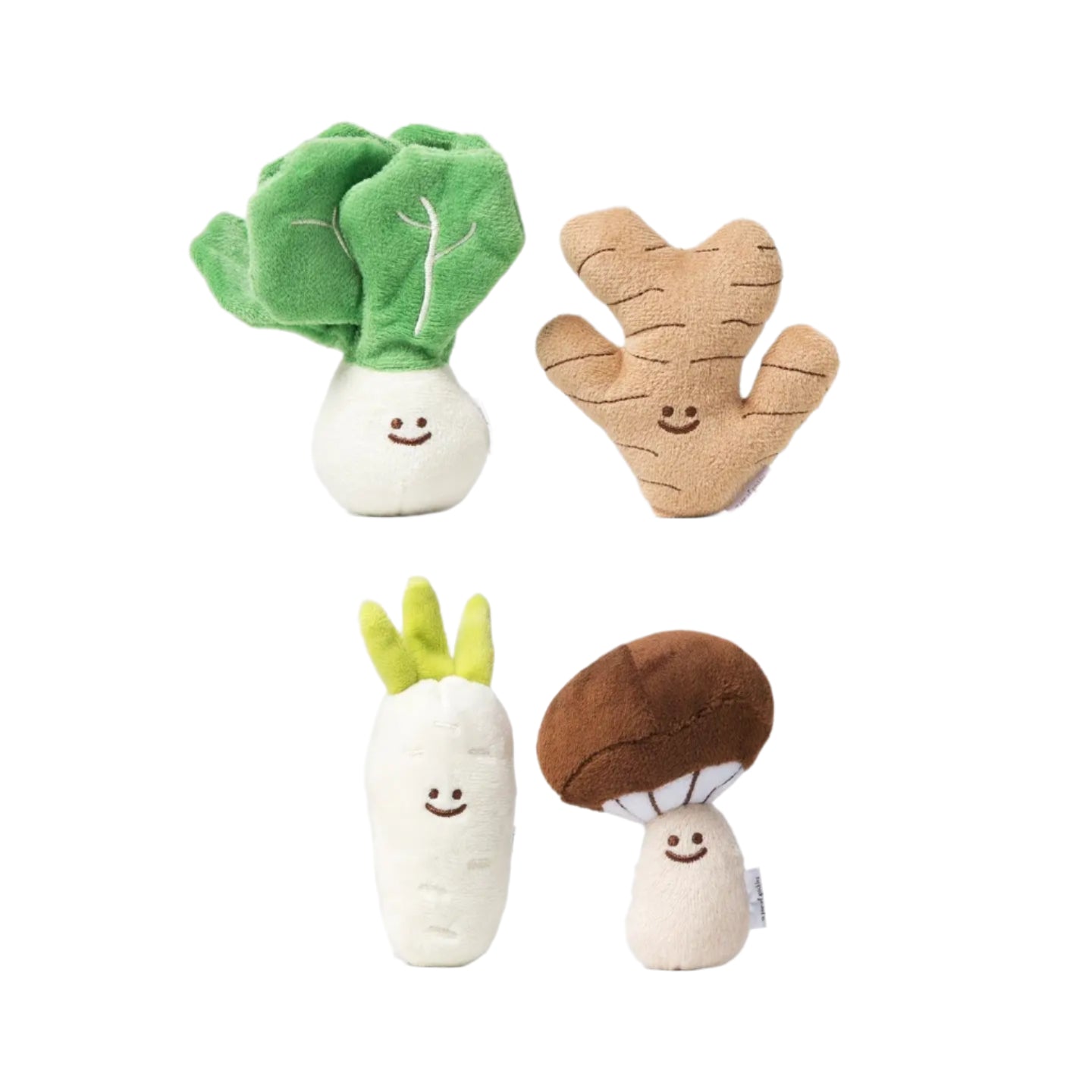 Set of plush vegetable toys on a white background