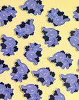 Pattern of purple cartoon-like creatures with black accents on a yellow background
