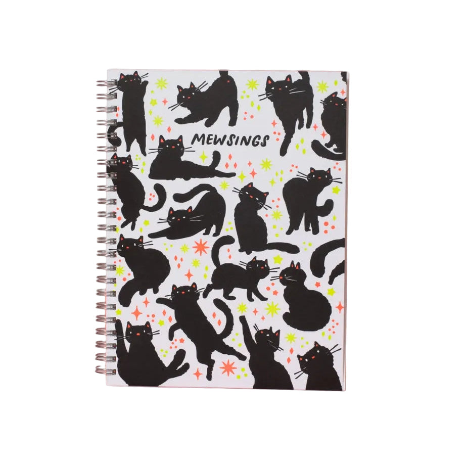 Notebook with black cat pattern on a pink background