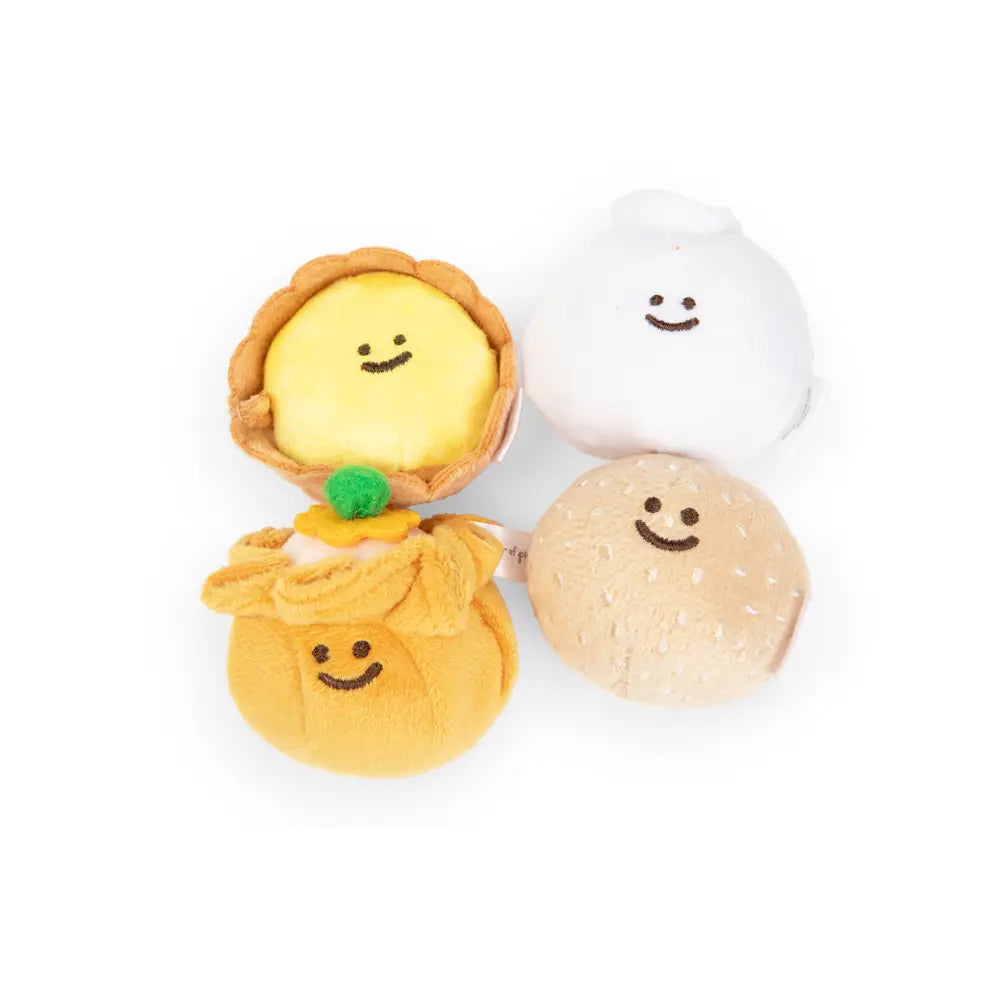 Stuffed fabric Dim Sum dumplings on white background