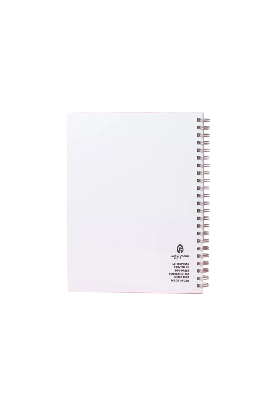 White notebook with black text on a pink background