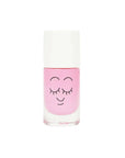 Baby pink nail polish featuring a smiley face with closed eyes and thin eyebrows on the glass portion of the bottle.