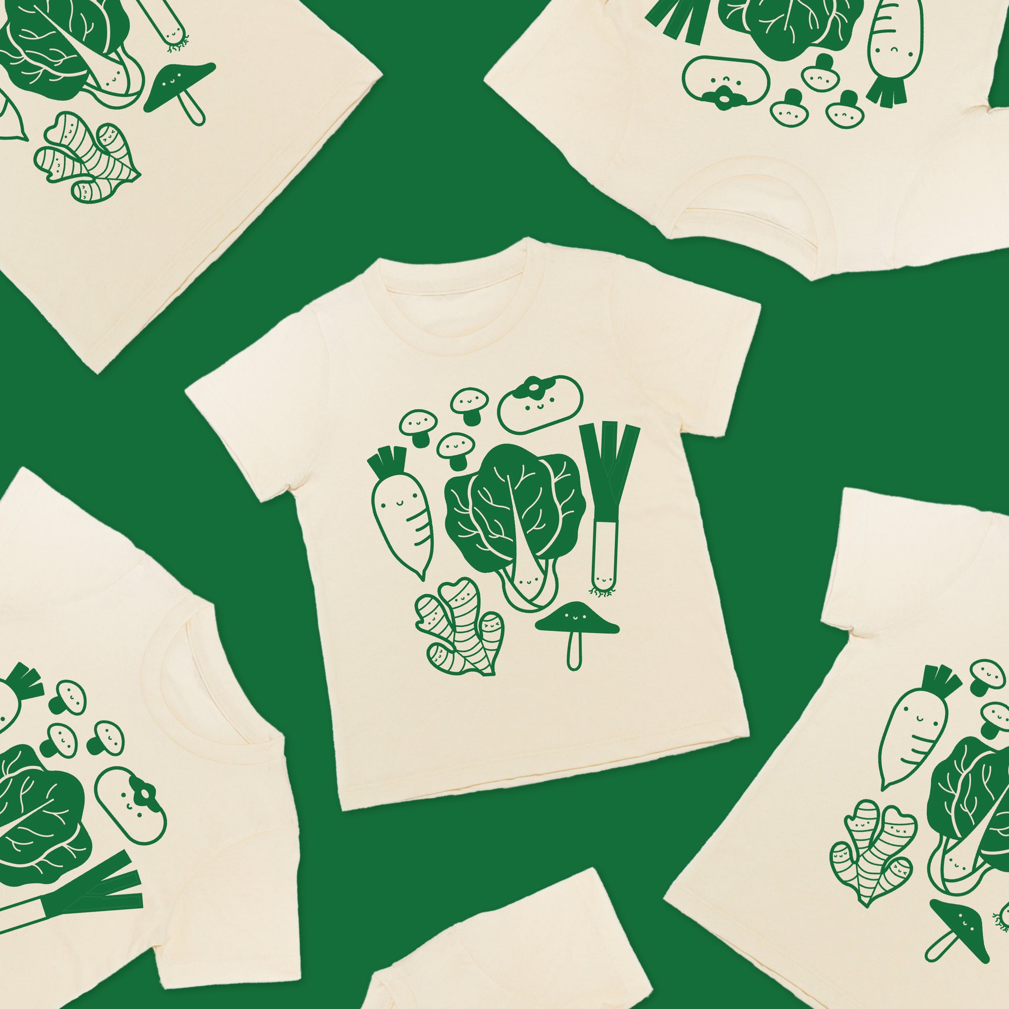 Green background with six  shirts in arranged at random. The tee is white with green screen print of popular asian vegetables.