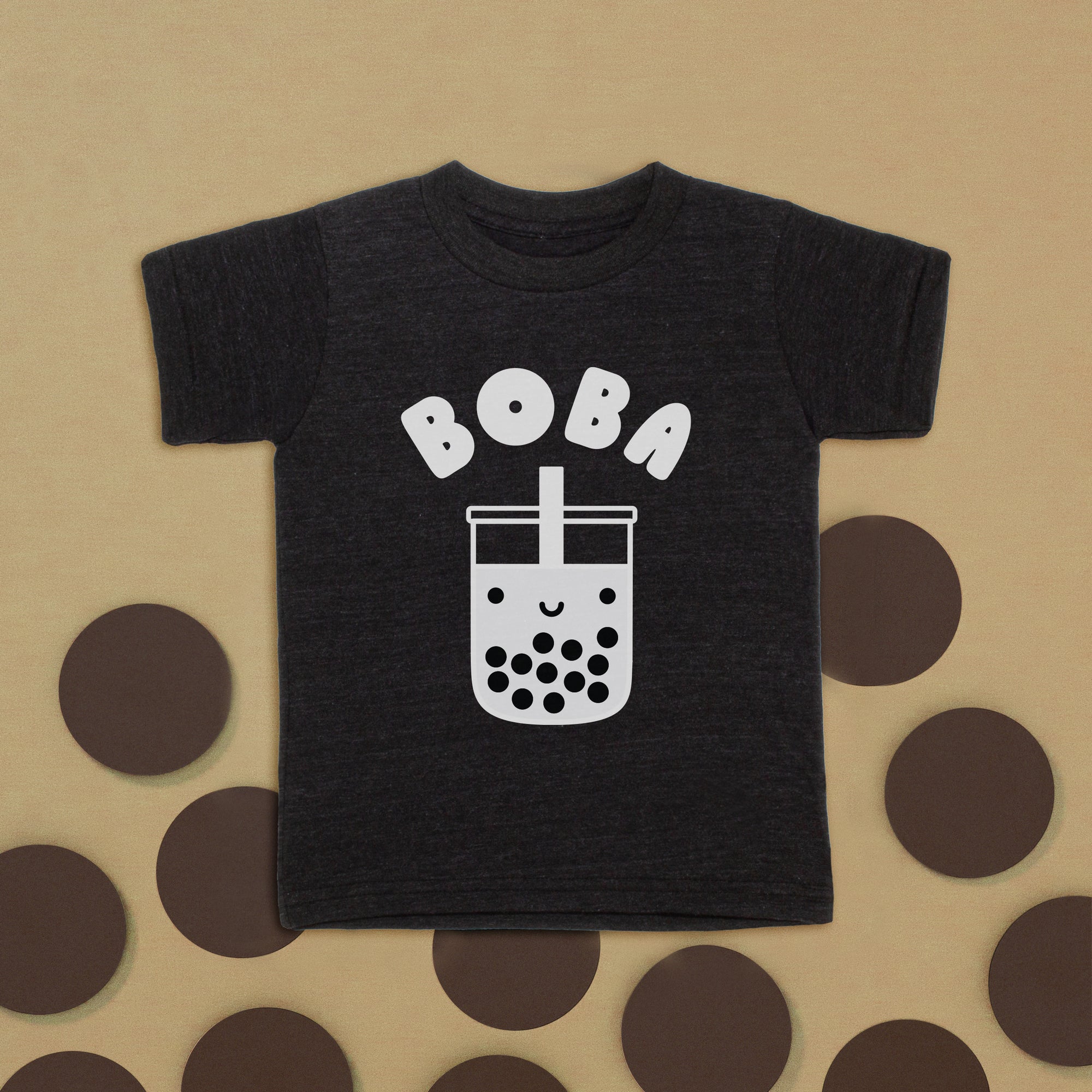 Black tee with screen printed white ink text BOBA above a smiling glass of boba.