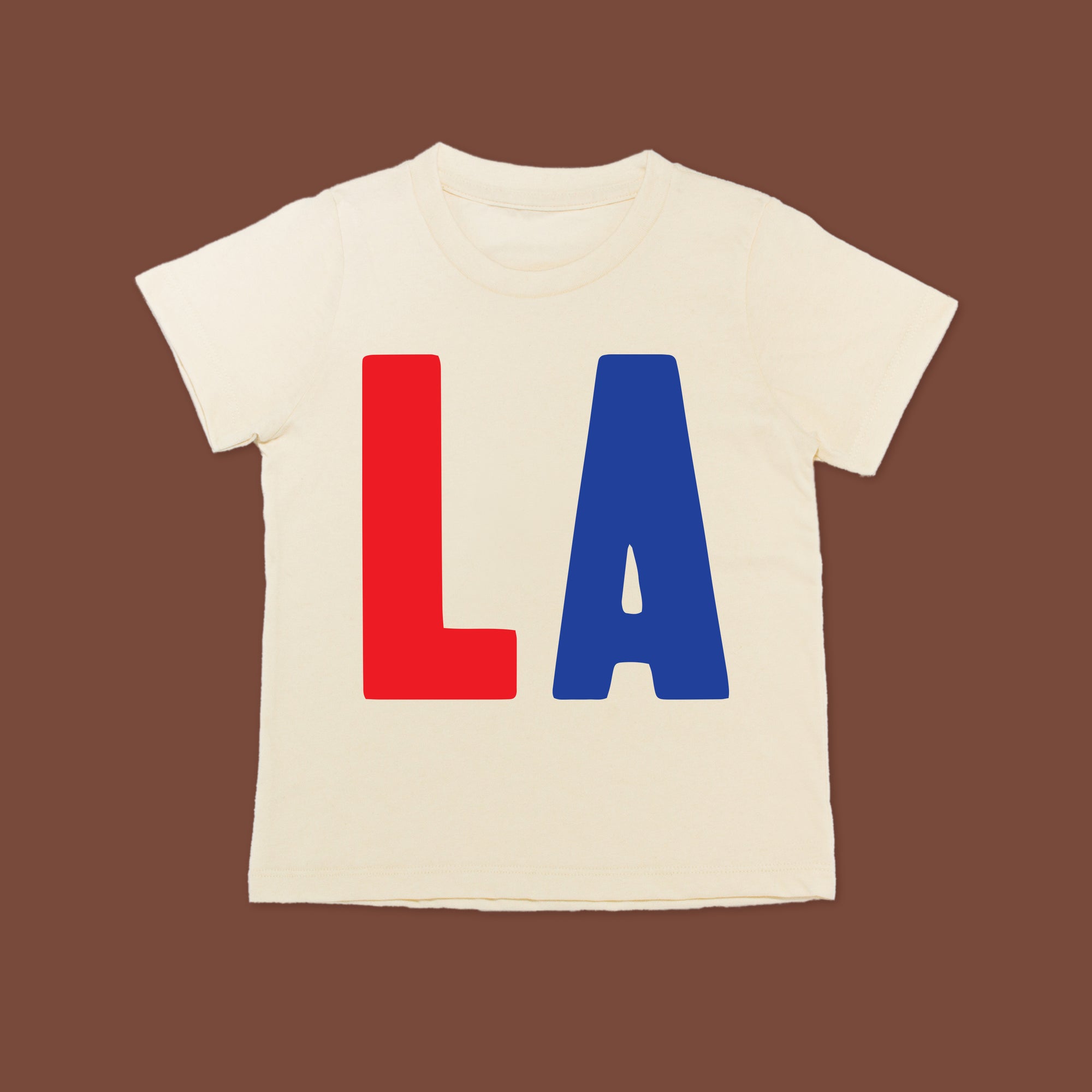 White tee screen printed with red L and blue A.