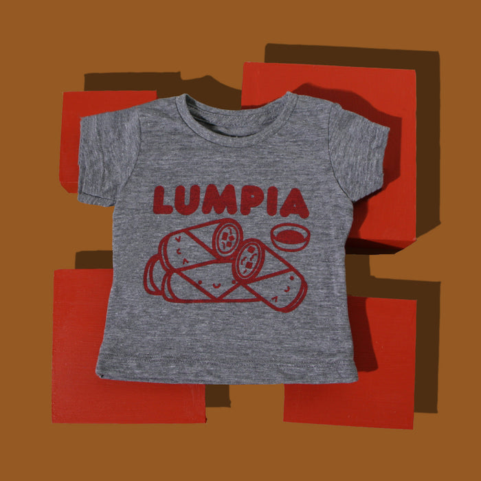 Grey tee screen printed with red ink text LUMPIA above three  smiling lumpia and dipping sauce.