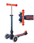 Navy and red foldable  three wheeled scooter with telescoping handlebars with light up wheels.
