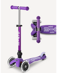 Purple and white foldable  three wheeled scooter with telescoping handlebars with light up wheels.