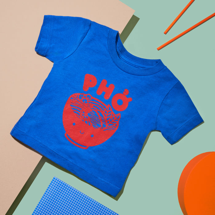 Blue tee screen printed with red ink text Pho above a smiling bowl of Pho.