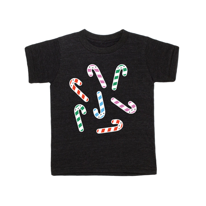 Black tee screen printed with green, red, blue, and purple smiling candy canes.