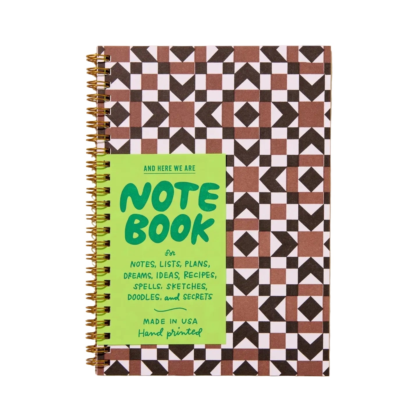 Notebook with geometric pattern and green label on a beige background