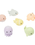 Pastel colored bath toys shaped like animals of the ocean Clown Fish Shark Crab Whale Octopus and Puffer Fish.