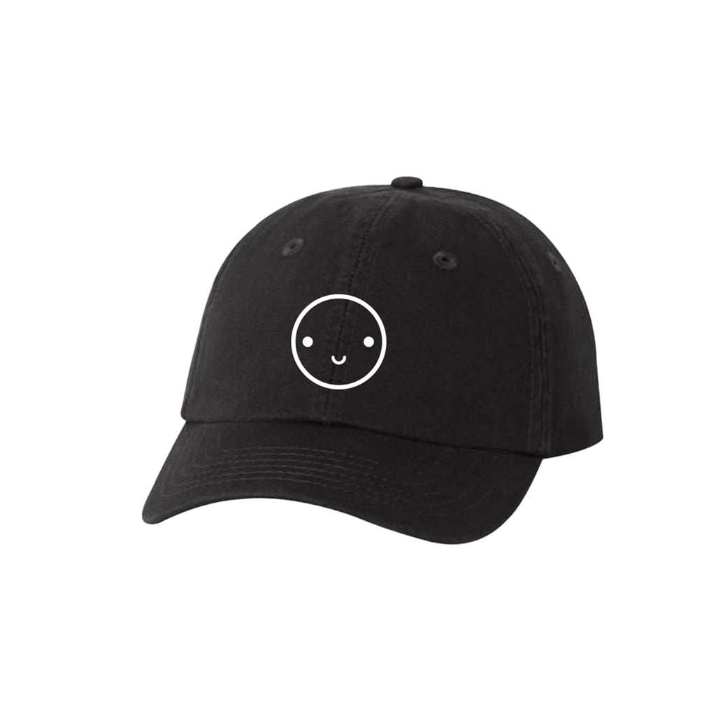 Black baseball hat with white embroidered smiley face.