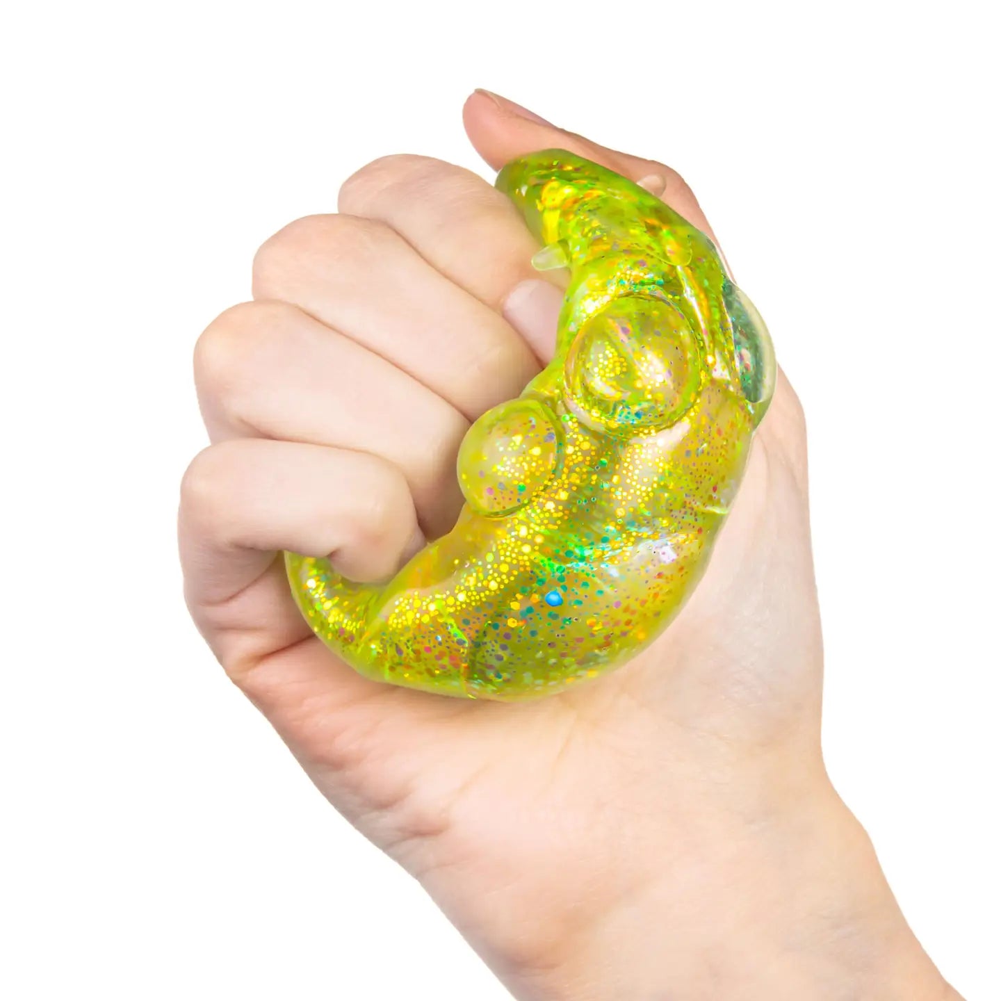 A hand squishing a green cat paw shaped squishy toy. 